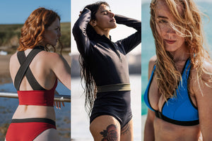 Three images together, the first a back view of a lady with red hair looking out to sea, wearing a bold red and black crossback swim top and red bikini briefs.  The second, a lady wearing a black long sleeve top and black high waisted bikini briefs, reaching her hands up to her head.  The third, a blonde woman looking into the camera with her hair blown over her face wearing a blue bikini top
