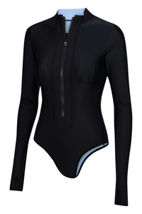 A side view flat lay image of a Davy J Sustainable Waterwear powder blue long sleeve swimsuit black side out with zip detail
