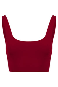 A front view flat lay image of a red Davy J Sustainable Waterwear cropped swim top with a square neckline and shoulder straps